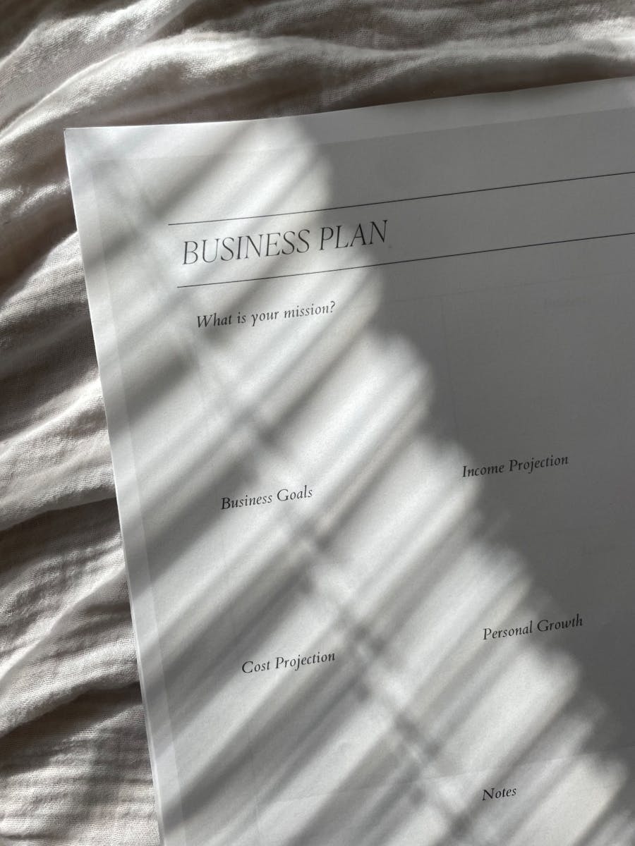 Close-up of a minimal business plan paper with shadow patterns.